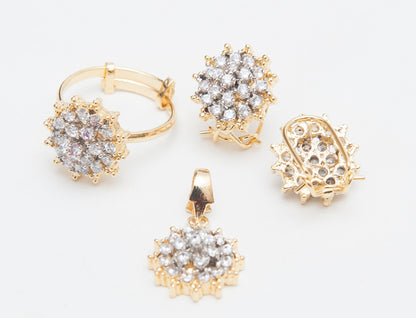 Gold and diamond jewelry set on a light gray background