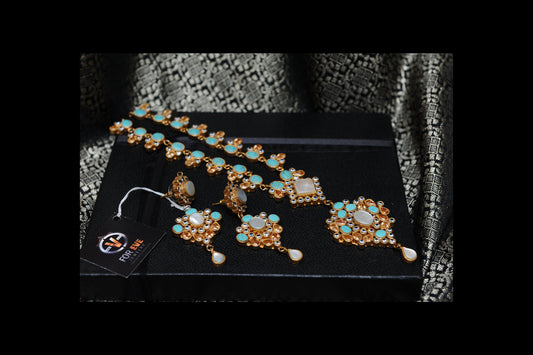 Jewelry set including necklace, earrings, and ring on a black box with a brand tag.