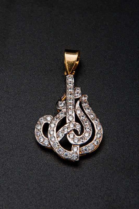 Gold and diamond pendant on a black background