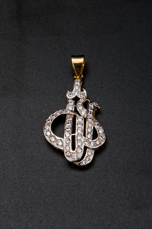 Diamond-encrusted key-shaped pendant on a black background