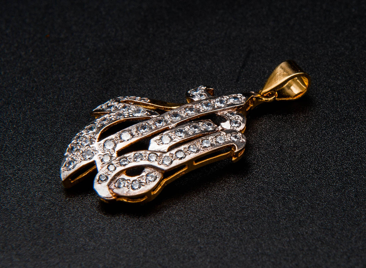 Gold and diamond pendant on a black background