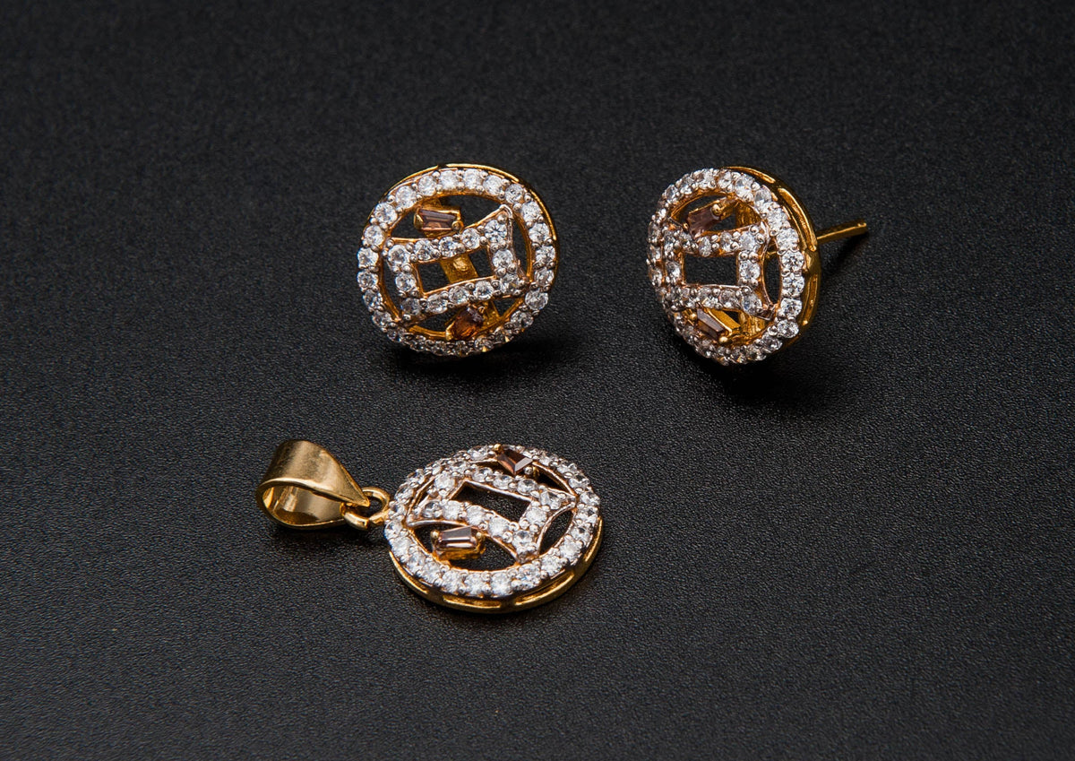 Gold earrings with gemstones on a black background