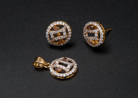Gold earrings with gemstones on a black background